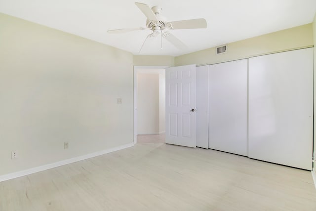 unfurnished bedroom with a closet, ceiling fan, and light hardwood / wood-style floors