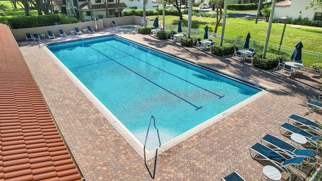 view of swimming pool with a patio area