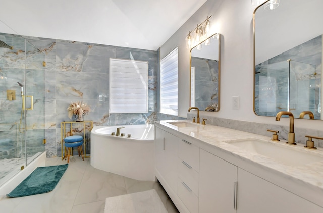 bathroom featuring shower with separate bathtub, vanity, tile patterned flooring, lofted ceiling, and tile walls