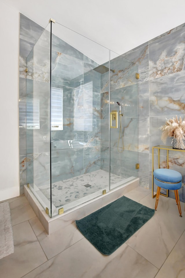 bathroom with tile patterned flooring and an enclosed shower