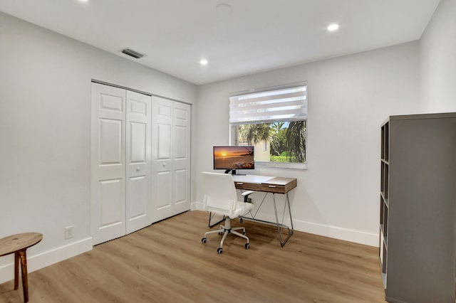 office space with light hardwood / wood-style floors