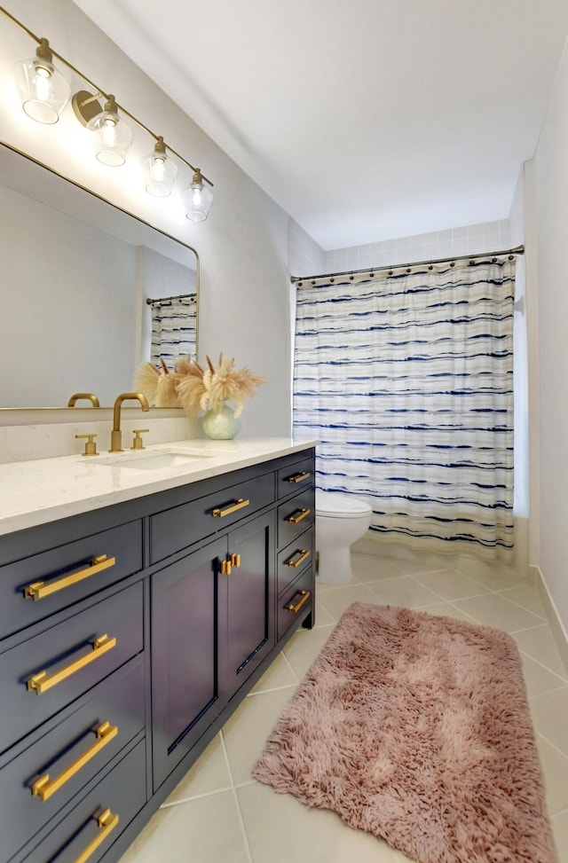 full bath featuring shower / tub combo, tile patterned flooring, vanity, and toilet