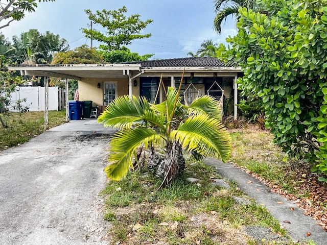 bungalow-style home with a carport