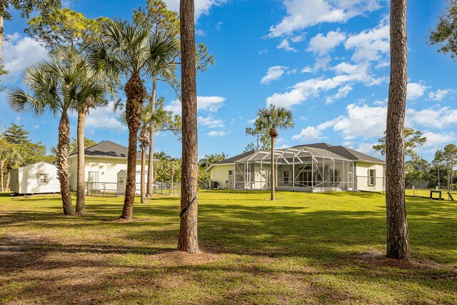 view of yard with a lanai