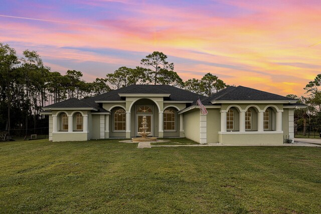 view of front of home with a yard