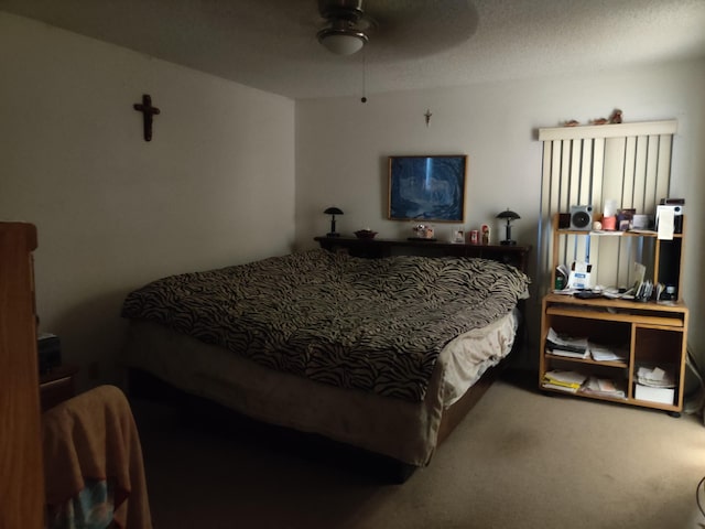 bedroom featuring ceiling fan and carpet flooring