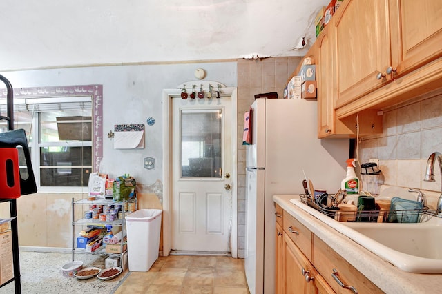 kitchen featuring white refrigerator and light tile patterned flooring