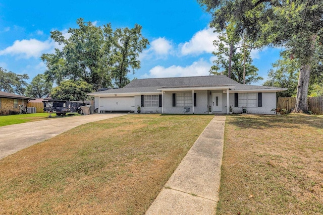 ranch-style home featuring a garage and a front yard