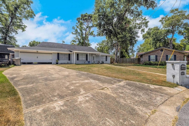 ranch-style home featuring a front lawn and a garage