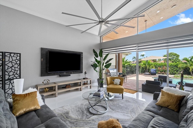 living room featuring tile patterned flooring and a towering ceiling