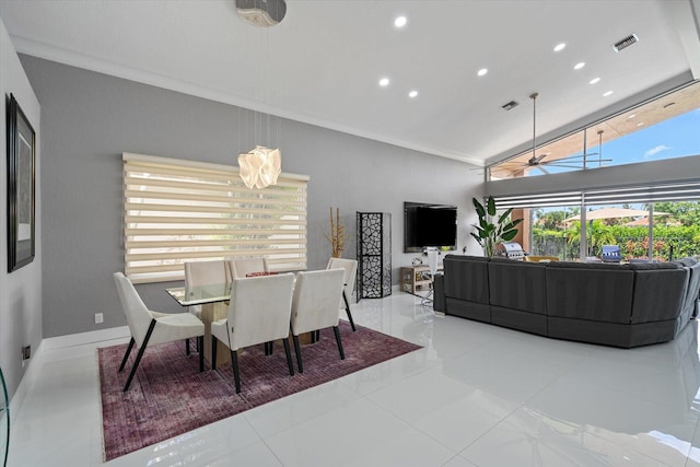 dining room with crown molding and light tile patterned flooring