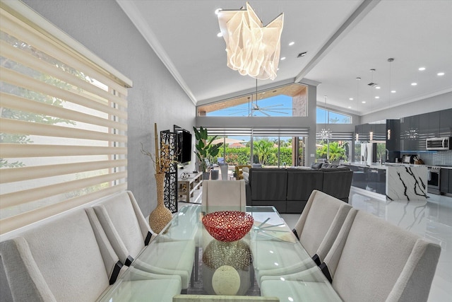 dining area with crown molding, a notable chandelier, high vaulted ceiling, and tile patterned floors