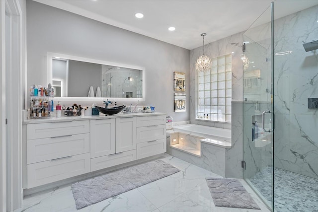 bathroom featuring vanity, an inviting chandelier, independent shower and bath, and tile patterned floors