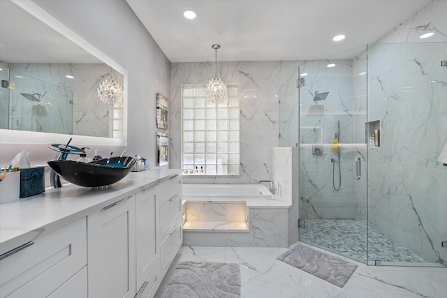 bathroom featuring plus walk in shower, tile patterned flooring, a notable chandelier, and vanity