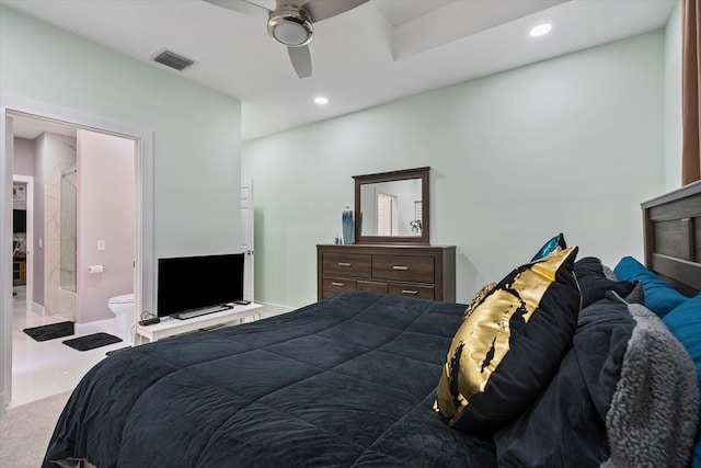 carpeted bedroom with ceiling fan and connected bathroom