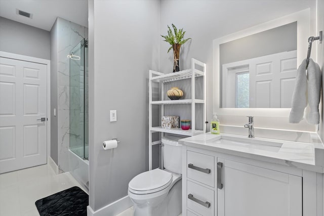 full bathroom featuring tiled shower / bath combo, vanity, toilet, and tile patterned floors