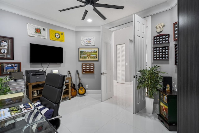 tiled home office featuring ceiling fan and ornamental molding