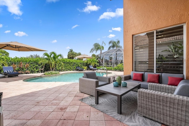 view of swimming pool featuring an outdoor living space, a lanai, and a patio