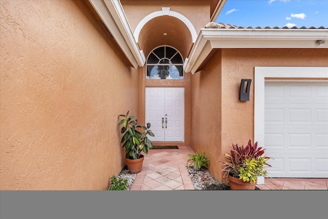 entrance to property featuring a garage