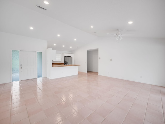 unfurnished living room featuring ceiling fan, visible vents, vaulted ceiling, and recessed lighting