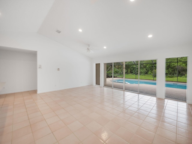 empty room featuring lofted ceiling, ceiling fan, recessed lighting, and light tile patterned floors