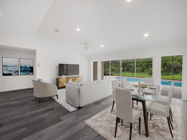 dining space featuring lofted ceiling, a ceiling fan, wood finished floors, and recessed lighting