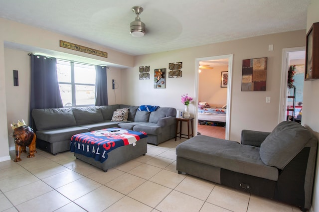 living room featuring ceiling fan and light tile patterned floors