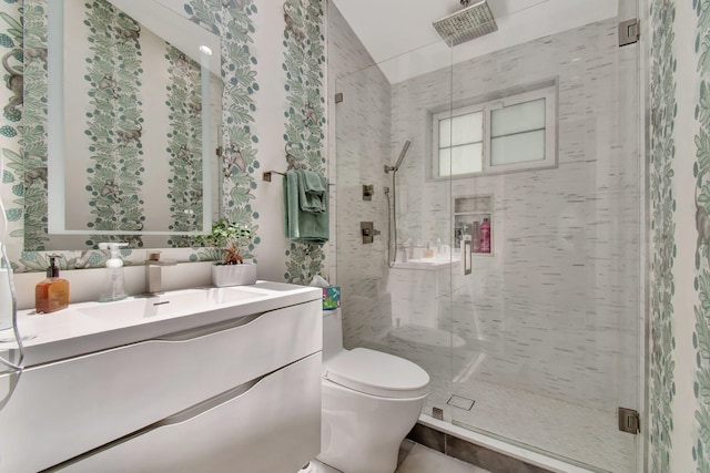 bathroom featuring tile patterned flooring, an enclosed shower, toilet, and vanity