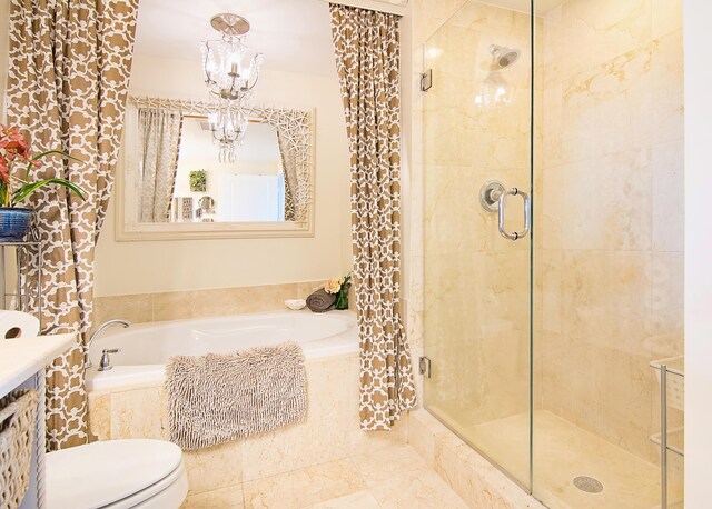 full bathroom with plus walk in shower, toilet, an inviting chandelier, and vanity