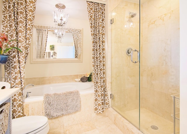 full bath featuring a garden tub, a notable chandelier, a shower stall, and toilet