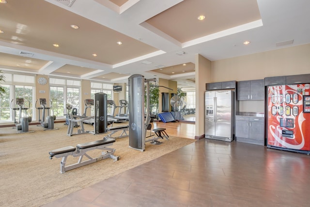 workout area featuring coffered ceiling and light tile patterned floors