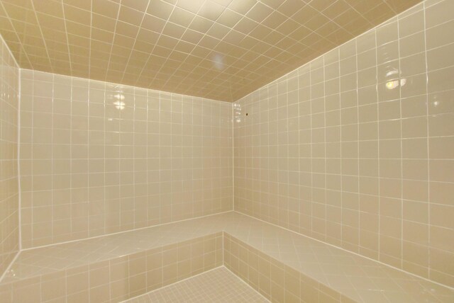 bathroom with a tile shower