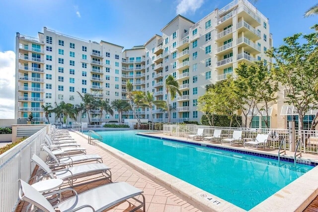 pool featuring a patio and fence