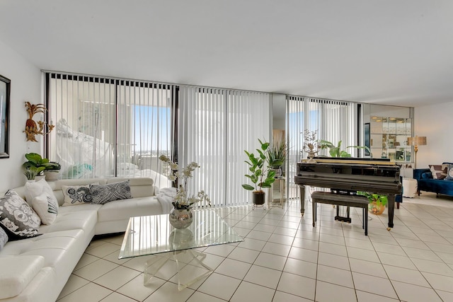 living room with a wall of windows and tile patterned floors