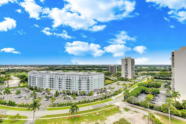 birds eye view of property with a view of city