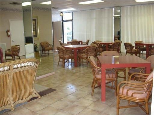 dining area featuring light tile patterned floors