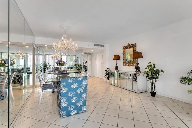 dining space with light tile patterned floors, visible vents, and a notable chandelier