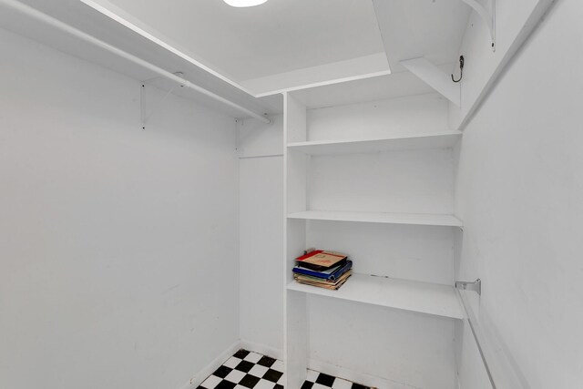 bathroom featuring a shower with door, toilet, and vanity