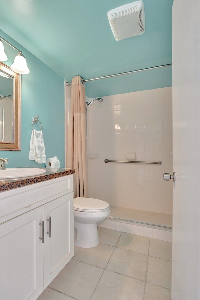 bathroom featuring vanity, toilet, and walk in shower