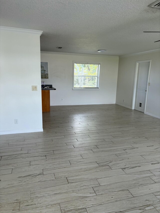 living room featuring light hardwood / wood-style floors, ceiling fan, and a textured ceiling