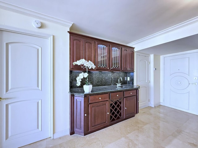 bar featuring crown molding, sink, and decorative backsplash