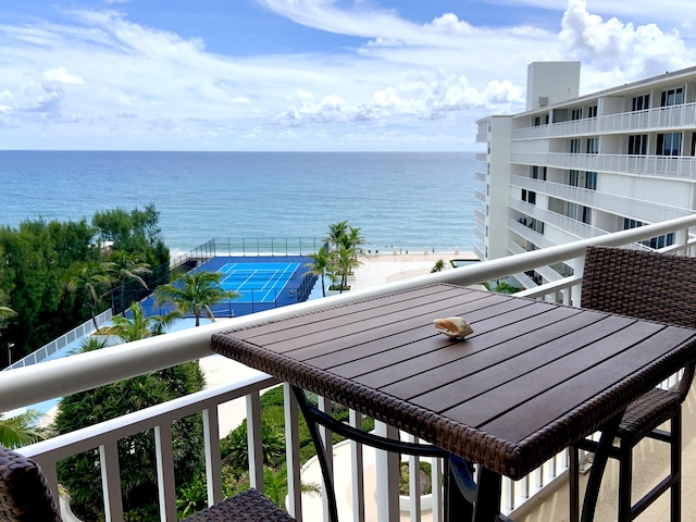 balcony featuring a water view