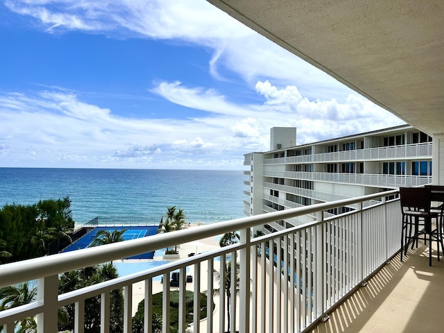 balcony featuring a water view