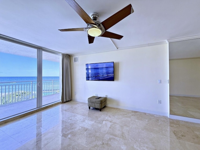 unfurnished room featuring floor to ceiling windows, ornamental molding, and ceiling fan