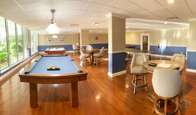 recreation room with ornamental molding, a paneled ceiling, hardwood / wood-style floors, and billiards