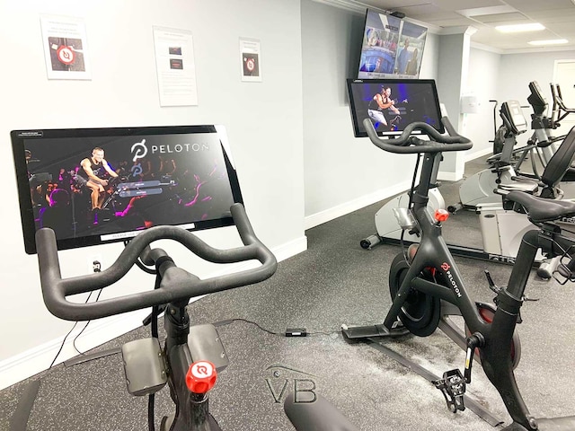 exercise area featuring a drop ceiling