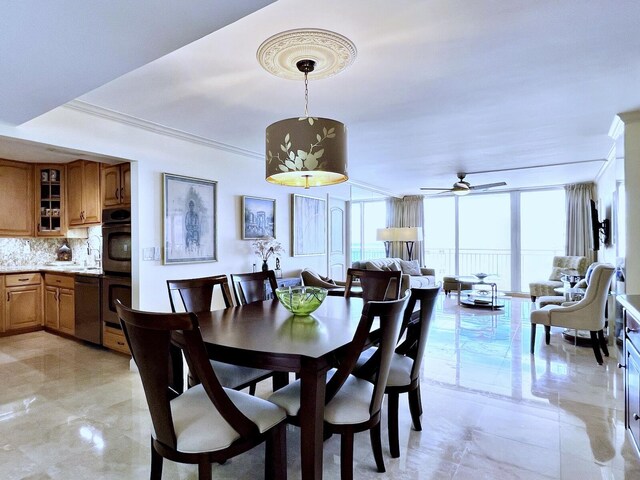 dining area featuring ornamental molding, floor to ceiling windows, and ceiling fan