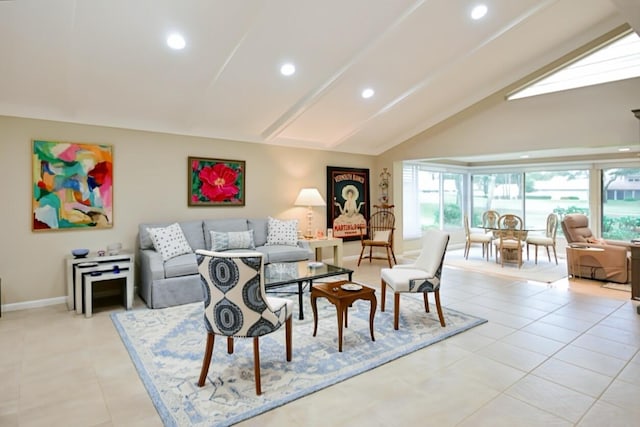 living room featuring baseboards, plenty of natural light, and recessed lighting