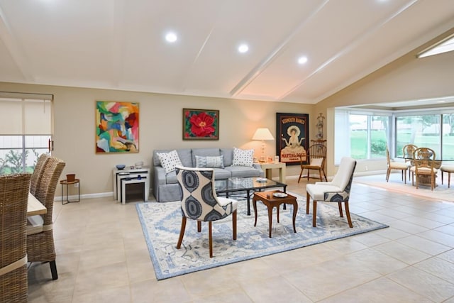 living room featuring high vaulted ceiling, baseboards, light tile patterned floors, and recessed lighting