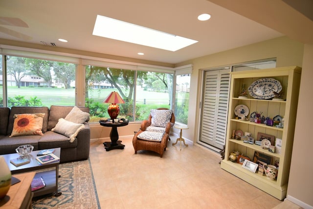 living area with a skylight and recessed lighting